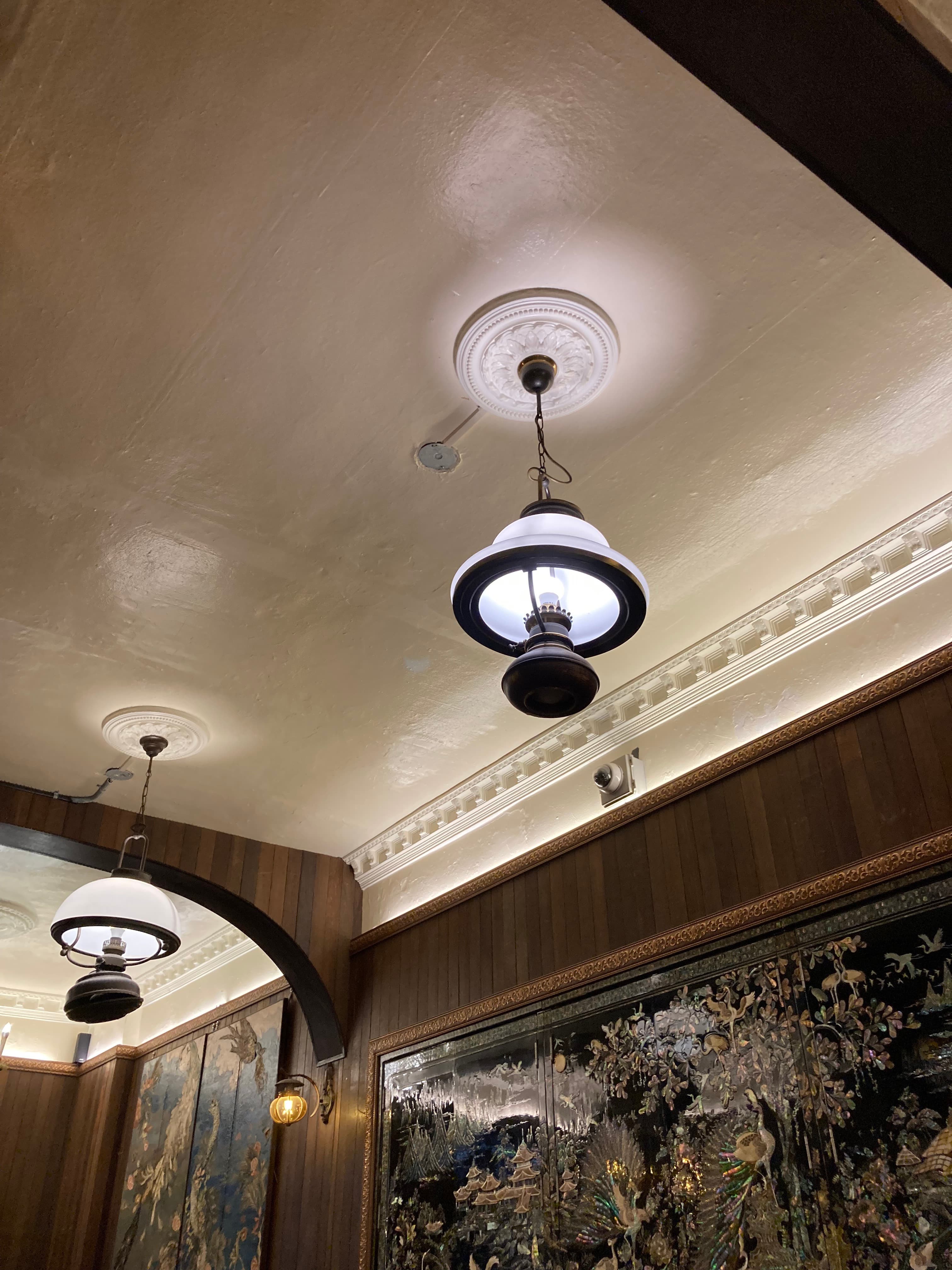 Traditional Korean interior with pearl-inlaid wooden screens and classical chandelier — feng shui composition