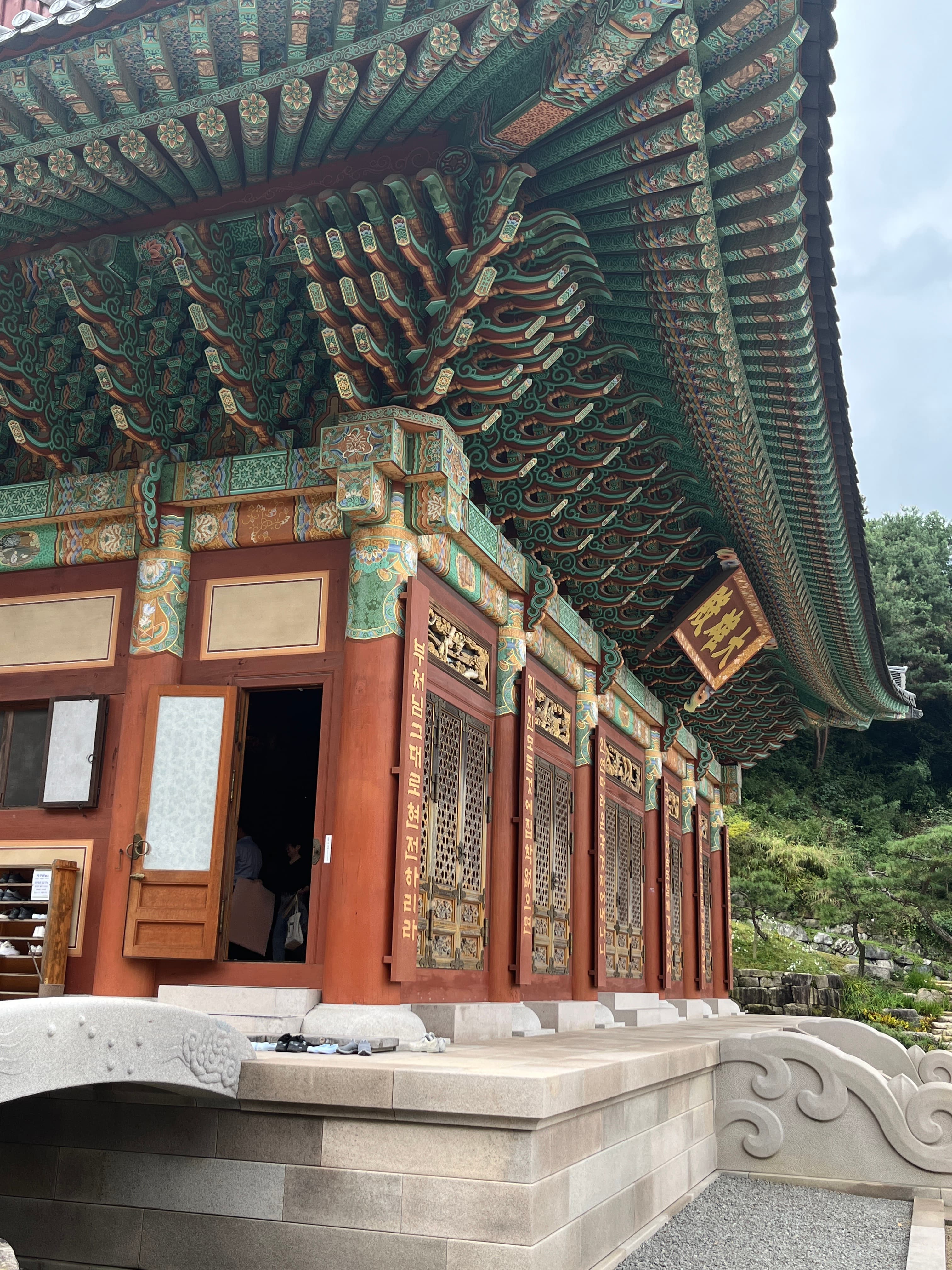 Painted eaves (단청) of a Korean palace — the tradition Sun reads charts within