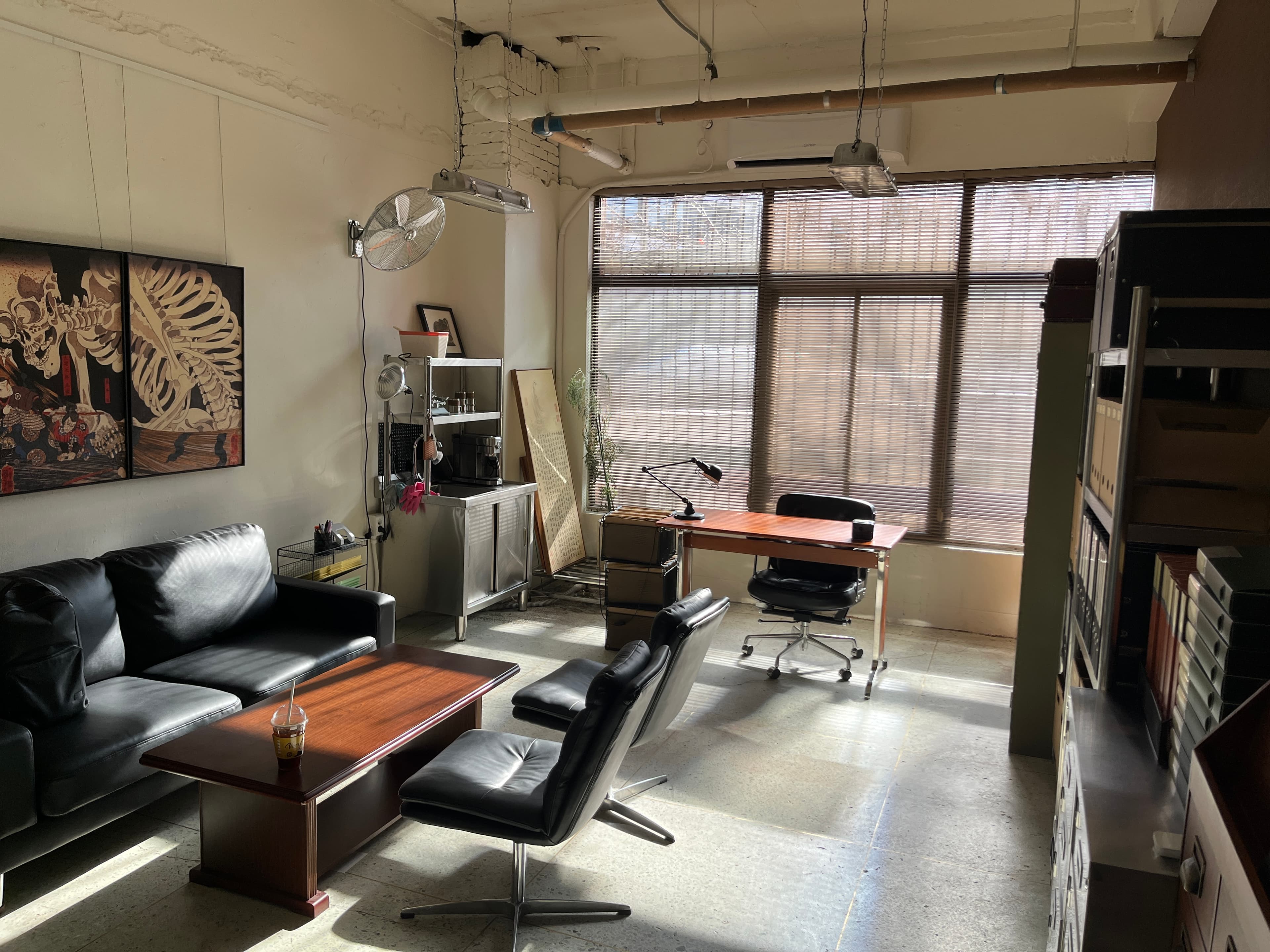 Sun Lee's studio in Seoul — desk, books, and afternoon light